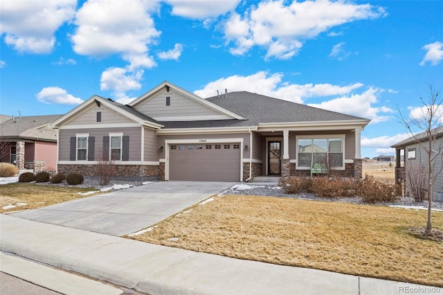 12664 Ulster St, Thornton, CO 80602 - craftsman-style home featuring a front lawn, concrete driveway, stone siding, and a garage