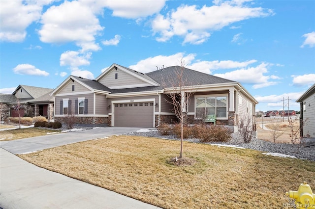12664 Ulster St, Thornton, CO 80602 - craftsman house featuring stone siding, driveway, an attached garage, and a front yard