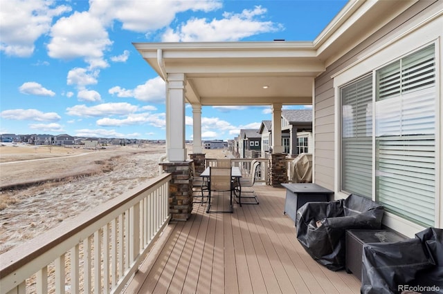 12664 Ulster St, Thornton, CO 80602 - wooden terrace with outdoor dining area and a residential view