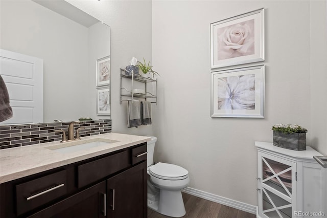 12664 Ulster St, Thornton, CO 80602 - bathroom with wood finished floors, vanity, and tasteful backsplash