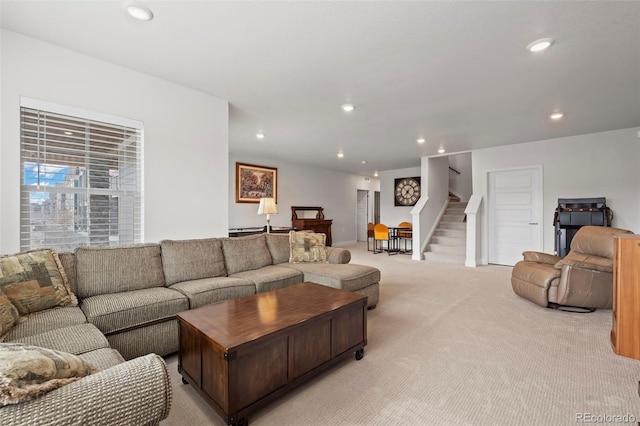 12664 Ulster St, Thornton, CO 80602 - living room featuring light colored carpet, stairway, and recessed lighting