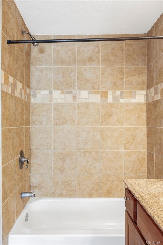 full bathroom featuring bathing tub / shower combination and vanity