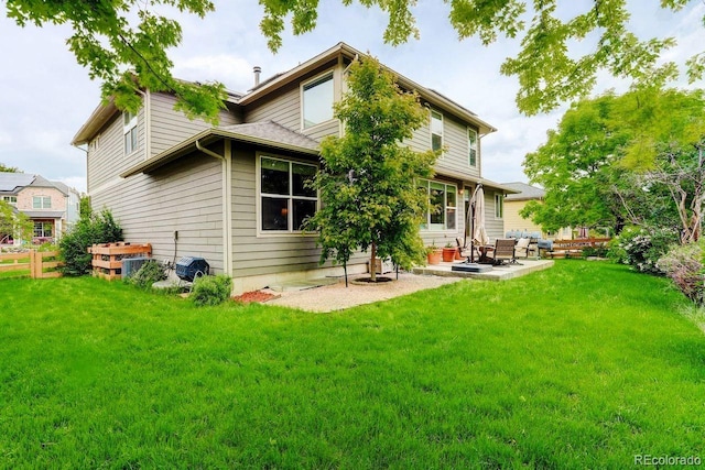 14200 W 86th Pl, Arvada, CO 80005 - back of house featuring a patio area and a lawn