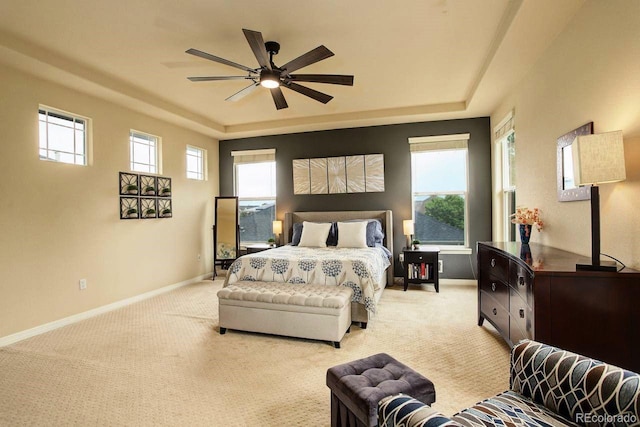 14200 W 86th Pl, Arvada, CO 80005 - bedroom with a raised ceiling, light colored carpet, baseboards, and a ceiling fan