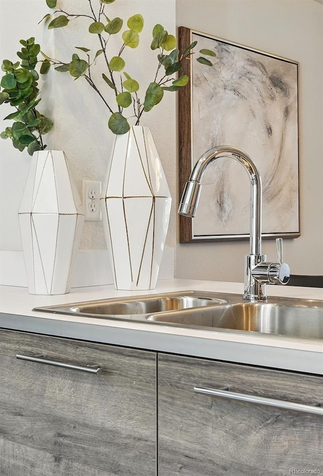 details featuring light countertops and a sink