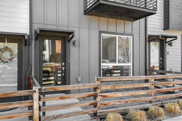 doorway to property with board and batten siding