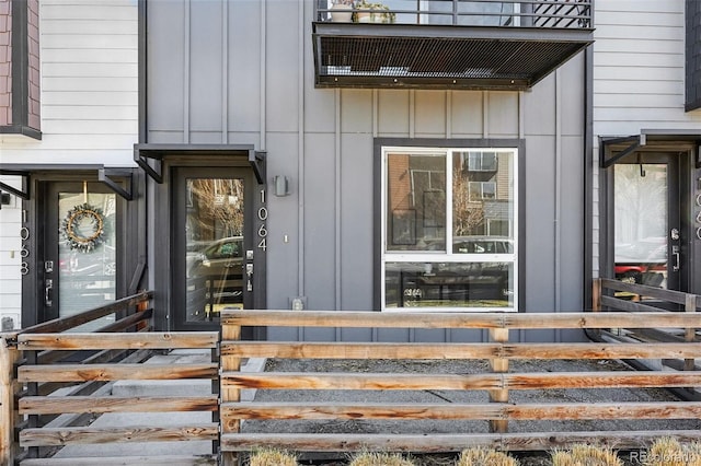 doorway to property featuring board and batten siding