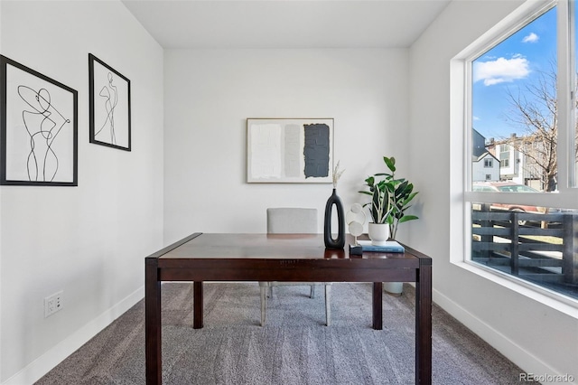 carpeted office space with baseboards