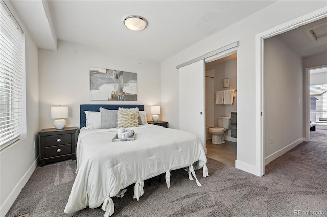 bedroom featuring connected bathroom, baseboards, and carpet flooring