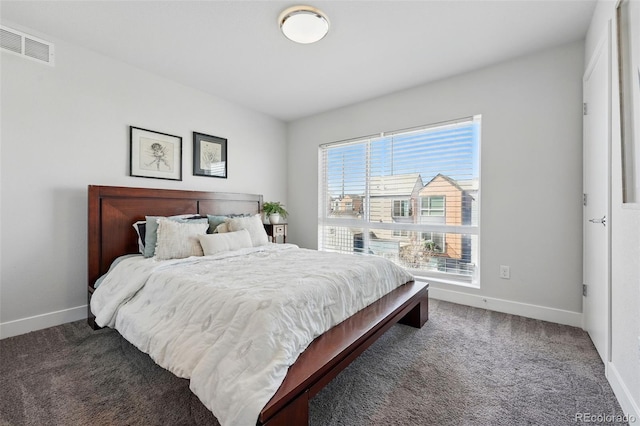 bedroom with carpet flooring, baseboards, and visible vents