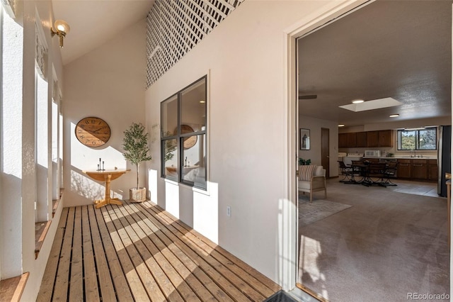 interior space featuring a patio, outdoor dining area, and a sink