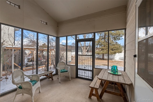 sunroom / solarium with vaulted ceiling and a wealth of natural light