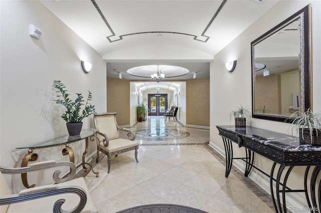 2500 E Cherry Creek S Drive 313, Denver, CO 80209 - corridor featuring baseboards, vaulted ceiling, and light tile patterned flooring