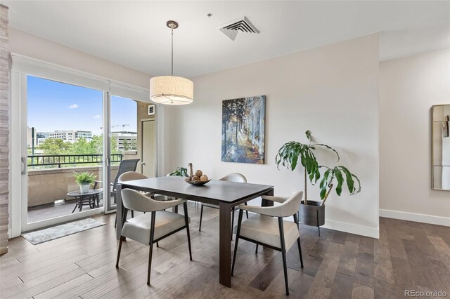 2500 E Cherry Creek S Drive 313, Denver, CO 80209 - dining area with dark wood-type flooring and baseboards