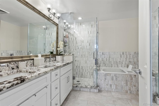 2500 E Cherry Creek S Drive 313, Denver, CO 80209 - bathroom with double vanity, a garden tub, tile patterned flooring, and a shower stall