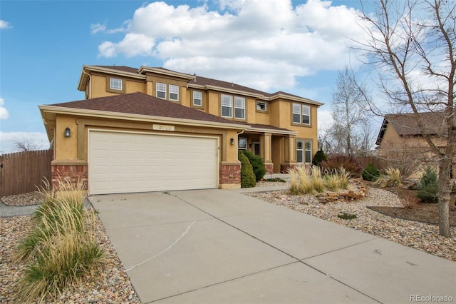 10725 Black Elk Way, Colorado Springs, CO 80908 - prairie-style home with an attached garage, concrete driveway, and stucco siding