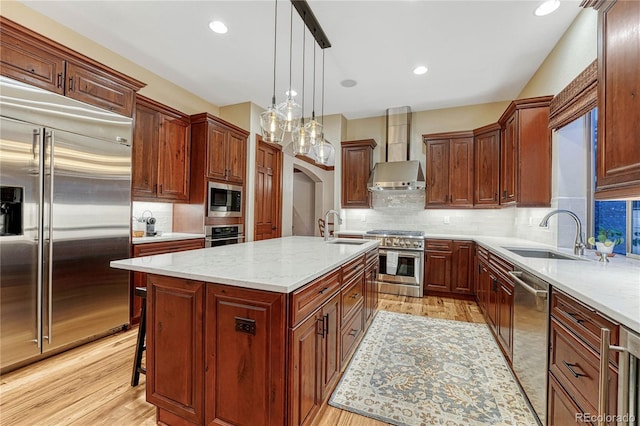 10459 Rivington Ct, Lone Tree, CO 80124 - kitchen with built in appliances, wall chimney exhaust hood, a sink, a center island with sink, and recessed lighting