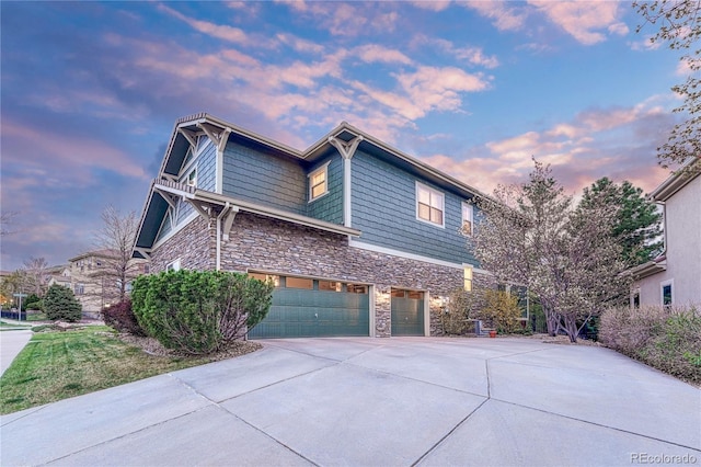 10459 Rivington Ct, Lone Tree, CO 80124 - view of side of property with stone siding, concrete driveway, and an attached garage
