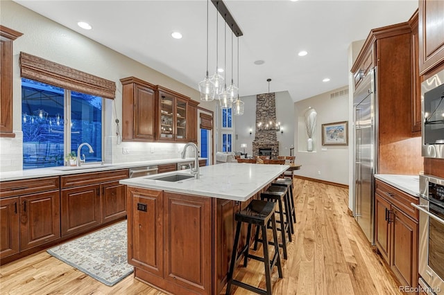 10459 Rivington Ct, Lone Tree, CO 80124 - kitchen featuring a sink, stainless steel appliances, light wood finished floors, and recessed lighting