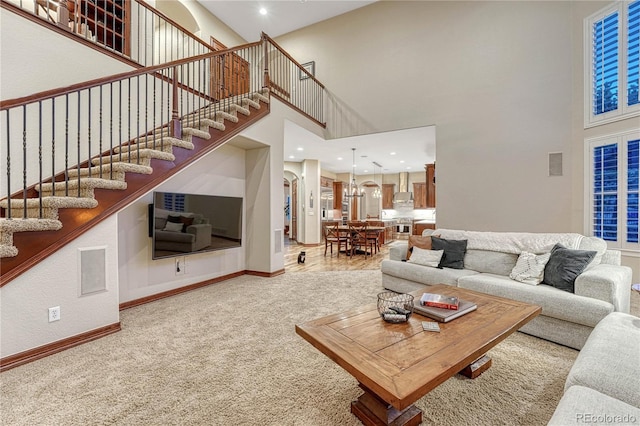10459 Rivington Ct, Lone Tree, CO 80124 - living room featuring a towering ceiling, carpet flooring, baseboards, stairs, and recessed lighting