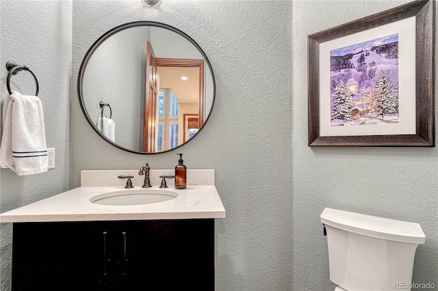 10459 Rivington Ct, Lone Tree, CO 80124 - bathroom featuring a textured wall, vanity, and toilet