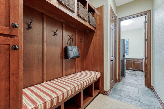10459 Rivington Ct, Lone Tree, CO 80124 - mudroom featuring a sauna, baseboards, a textured wall, and light stone finish flooring