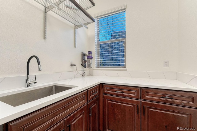 10459 Rivington Ct, Lone Tree, CO 80124 - kitchen with a sink and light stone countertops