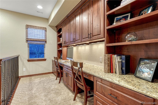 10459 Rivington Ct, Lone Tree, CO 80124 - home office featuring built in desk, light carpet, baseboards, and a textured wall