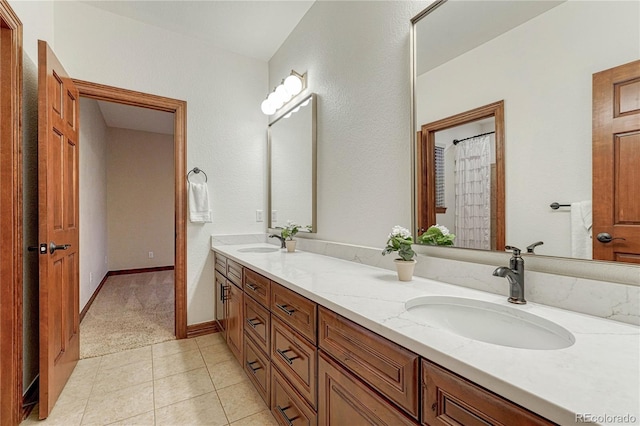 10459 Rivington Ct, Lone Tree, CO 80124 - full bath with double vanity, tile patterned flooring, and baseboards