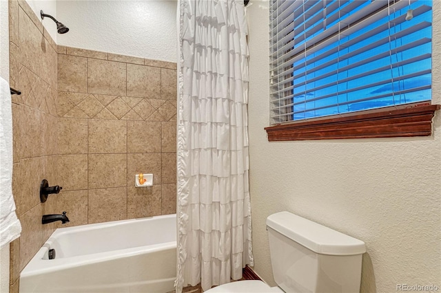 10459 Rivington Ct, Lone Tree, CO 80124 - full bathroom featuring a textured wall, toilet, and shower / tub combo