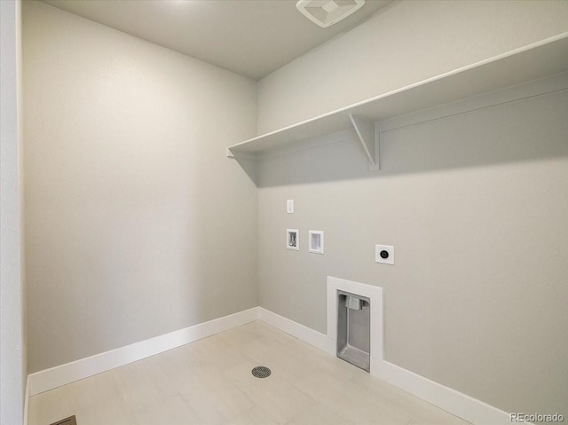 washroom with washer hookup, hookup for an electric dryer, and baseboards