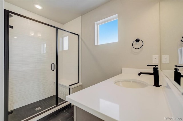 full bath featuring a stall shower, vanity, and recessed lighting