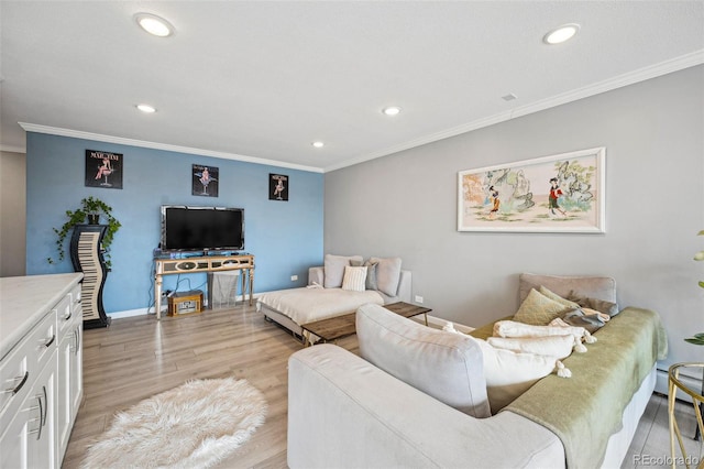 living area featuring ornamental molding, recessed lighting, and light wood-style floors