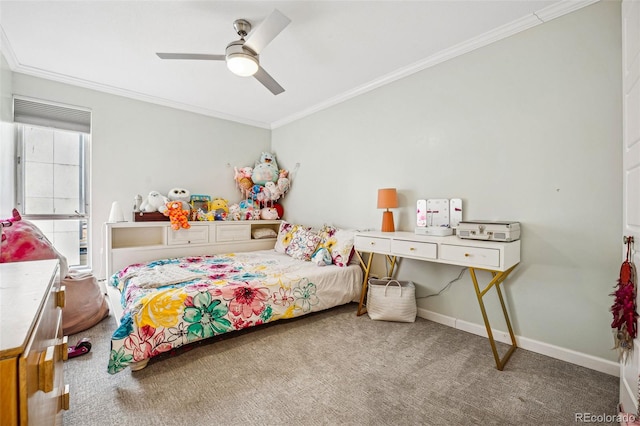 bedroom with carpet floors, crown molding, baseboards, and ceiling fan