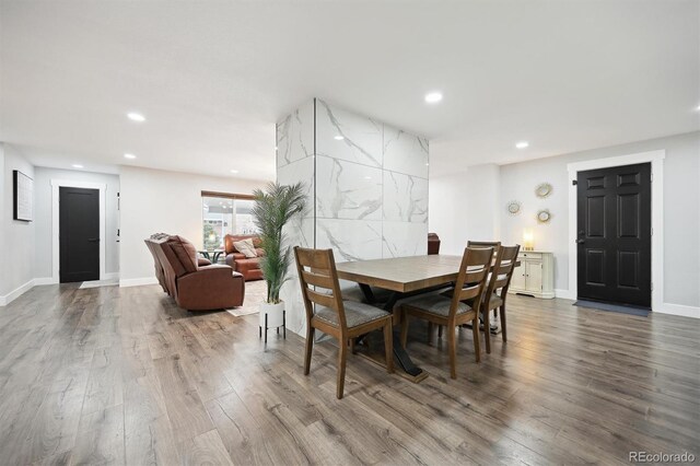 dining room with hardwood / wood-style flooring