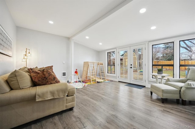 living room with french doors and wood-type flooring