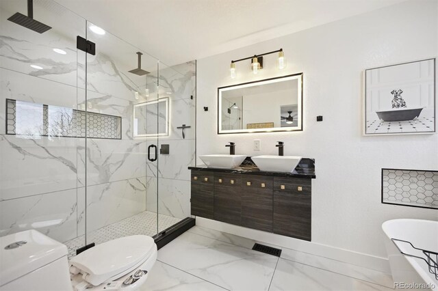 full bathroom featuring separate shower and tub, vanity, and toilet