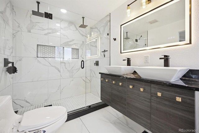 bathroom featuring toilet, an enclosed shower, and vanity