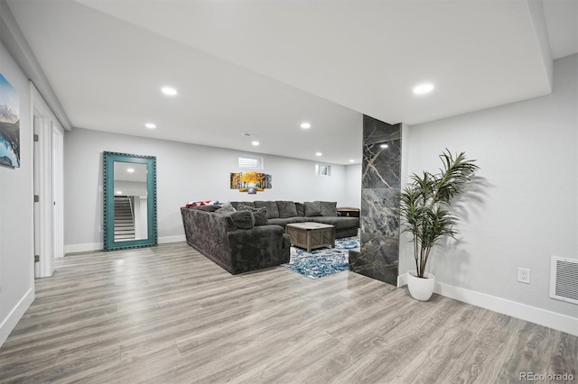 living room with light hardwood / wood-style flooring