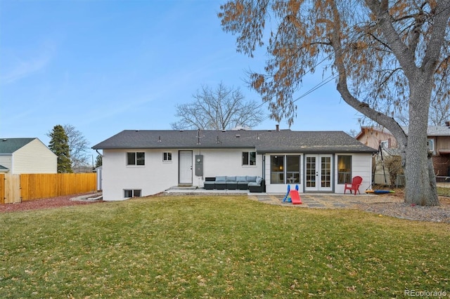 rear view of house featuring a lawn, french doors, a patio, and outdoor lounge area