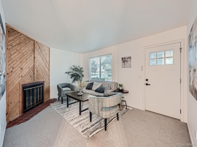 carpeted living room with a fireplace