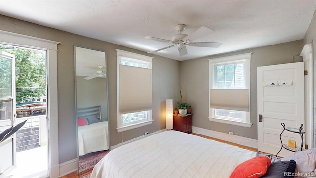 126 S Clarkson St, Denver, CO 80209 - bedroom with wood finished floors, ceiling fan, and access to outside
