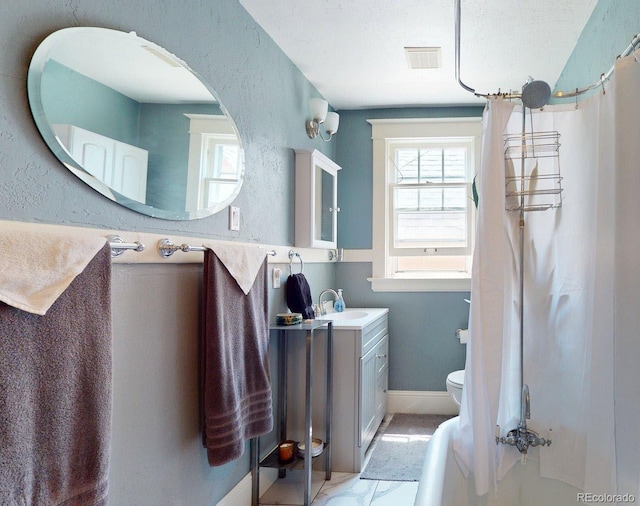 126 S Clarkson St, Denver, CO 80209 - bathroom with a shower with curtain, vanity, and marble look tile flooring