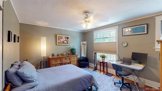 126 S Clarkson St, Denver, CO 80209 - bedroom featuring wood finished floors, a desk, crown molding, and a ceiling fan