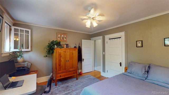 126 S Clarkson St, Denver, CO 80209 - bedroom featuring wood finished floors, crown molding, and a ceiling fan