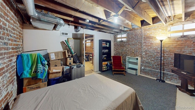 126 S Clarkson St, Denver, CO 80209 - bedroom with brick wall and carpet