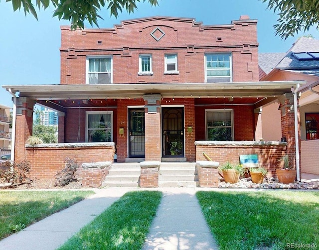 126 S Clarkson St, Denver, CO 80209 - view of front of house featuring brick siding and a porch