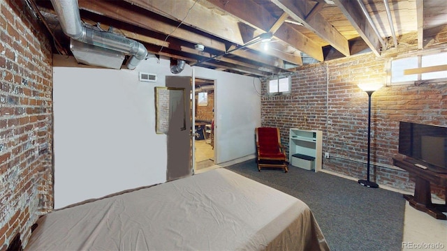 126 S Clarkson St, Denver, CO 80209 - carpeted bedroom featuring brick wall