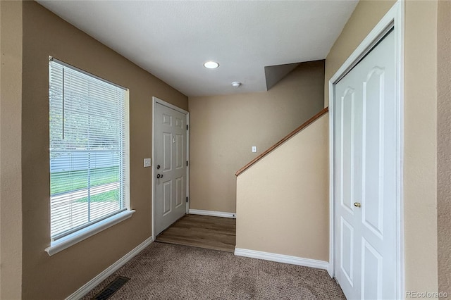 1419 Red Mountain Dr Unit 126, Longmont, CO 80504 - carpeted foyer featuring stairway and recessed lighting