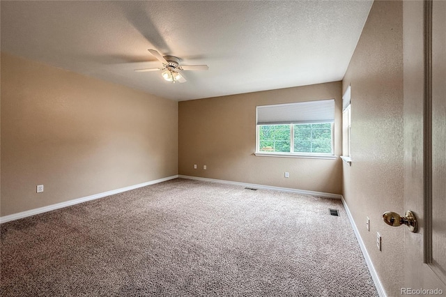 1419 Red Mountain Dr Unit 126, Longmont, CO 80504 - unfurnished room with a ceiling fan, carpet floors, and a textured ceiling